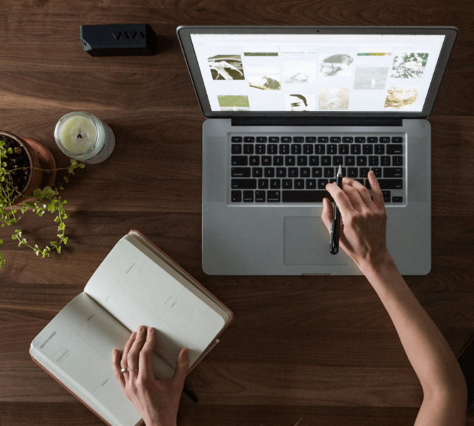An author's desk with a laptop and notebook
